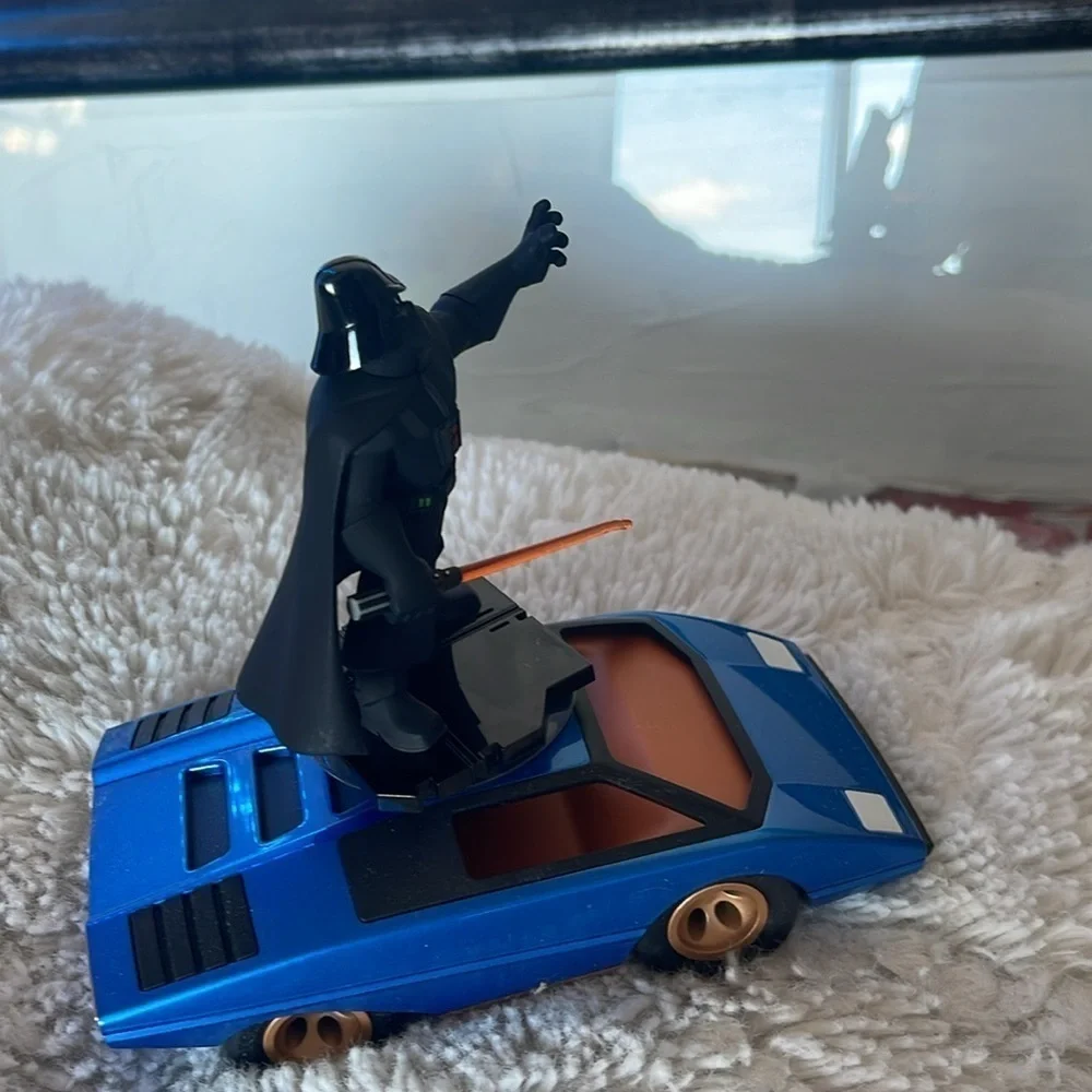 Darth Vader Figure on Blue Car